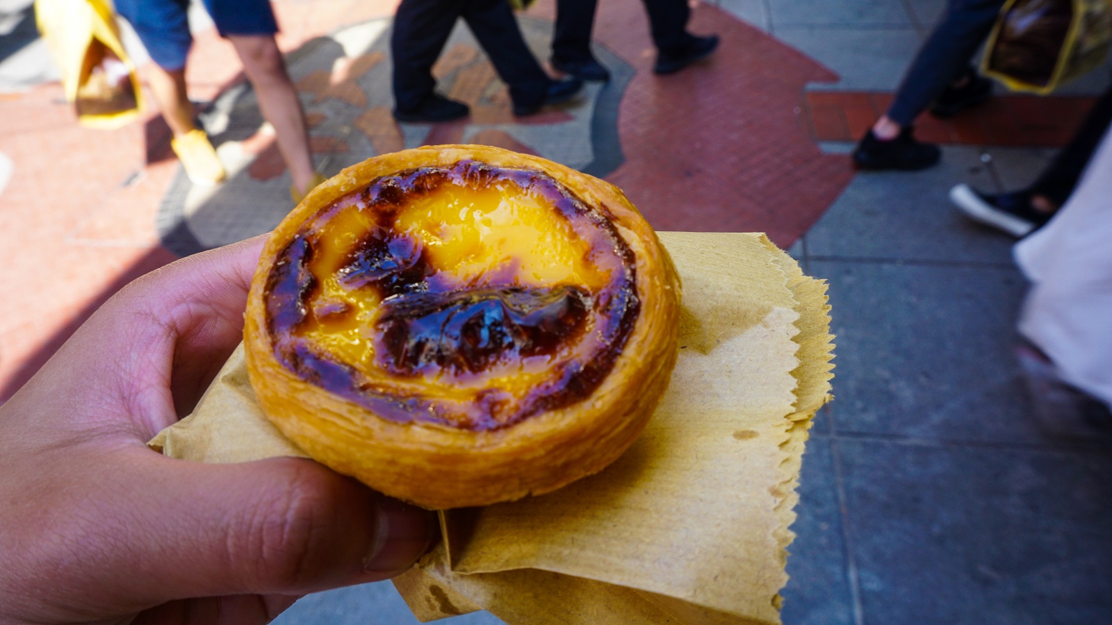 Savoring my precious Portuguese Egg Tart from Lord Stowe's Bakery during my day trip in Macau from Hong Kong