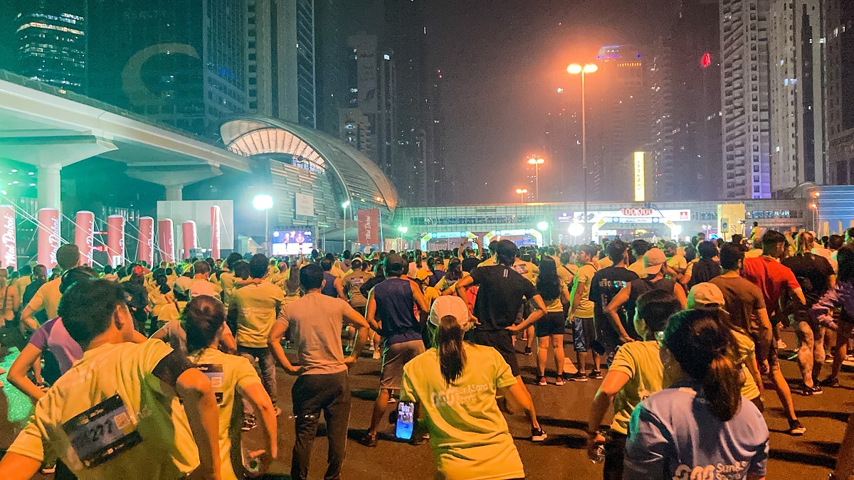 Warming Up by Fitness First while waiting for Dubai Run