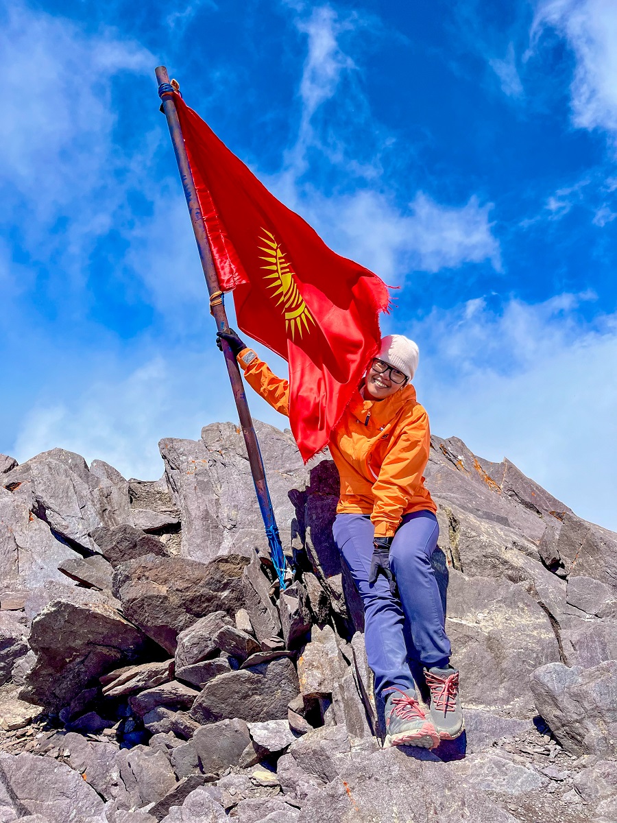 PinayHakawati at Komsomolets Peak with Kyrgyzstan Flag 