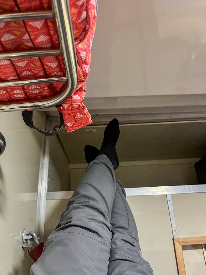Extending my legs to the storage area inside the cabin 