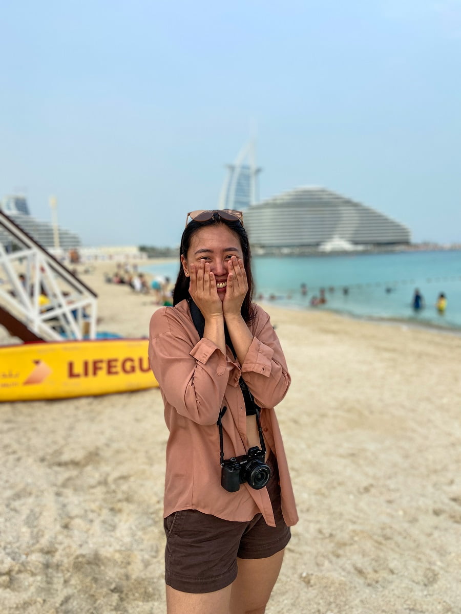 Posing shyly with Burj Al Arab in Dubai, UAE