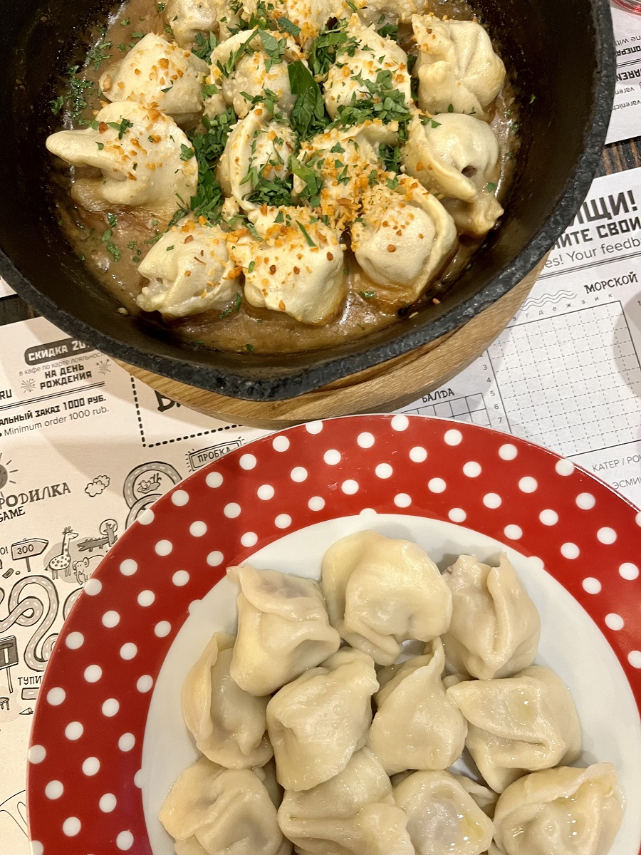 Trying traditional food Pelmeni during my travel to Russia
