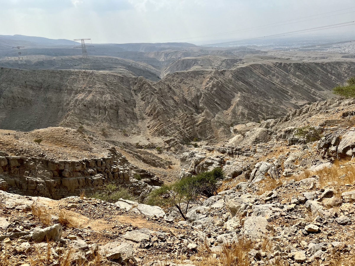 Overlooking plateau and transmission tower 