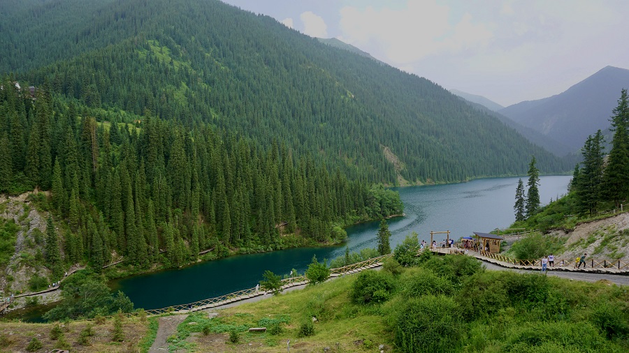 A budget tour to the lower lake of Kolsai Lakes in Southern Kazakhstan on a cloudy day