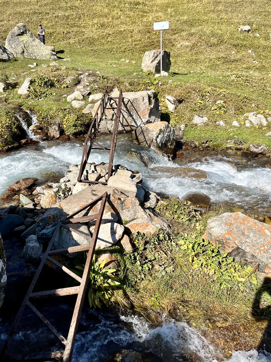 Metal bridge in Adgyene River in Ala Archa National Park