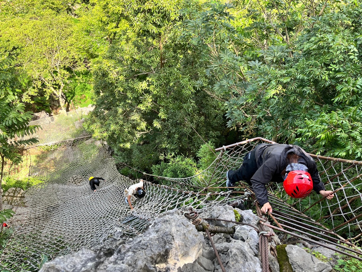 Going down the Bayawak rope course during hike in Masungi Georeserve via the Discovery Trail