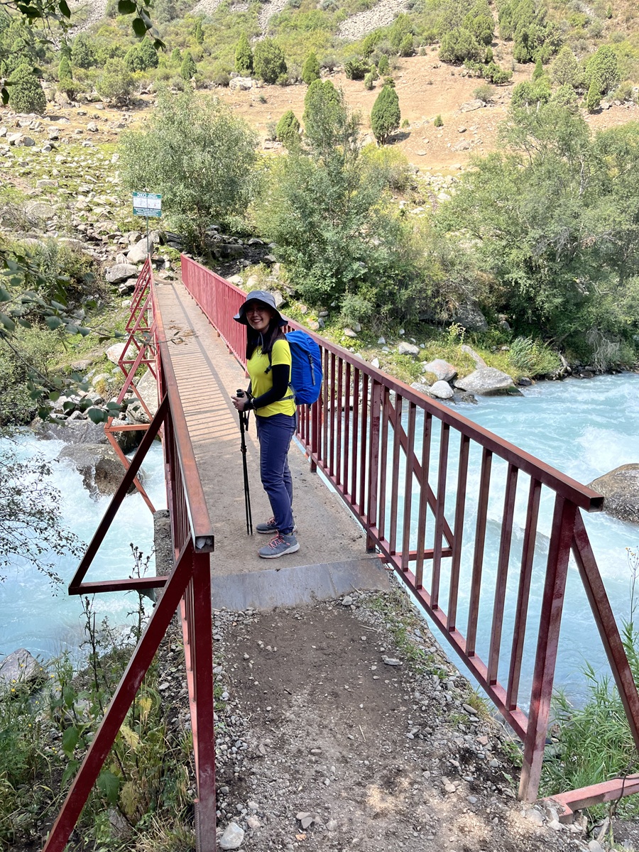 Red Bridge in Alamedin Gorge to cross the Alamedin River at the start of the hiking trail