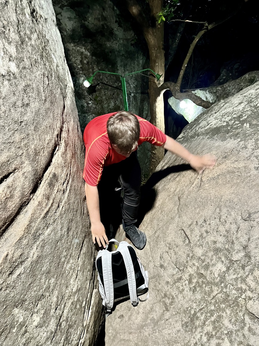Scrambling along boulders in Pidurangala Rock hike